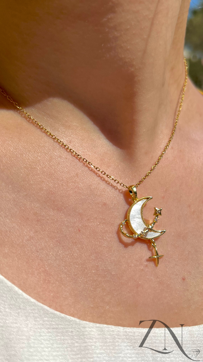 Stainless steel necklace featuring a crescent moon and star pendant with celestial detailing.