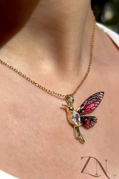 Gold-plated necklace featuring a detailed hummingbird pendant with delicate wings.