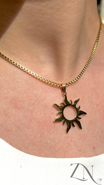 Gold sun-shaped pendant necklace inspired by fairy tale themes and Tangled-style design.