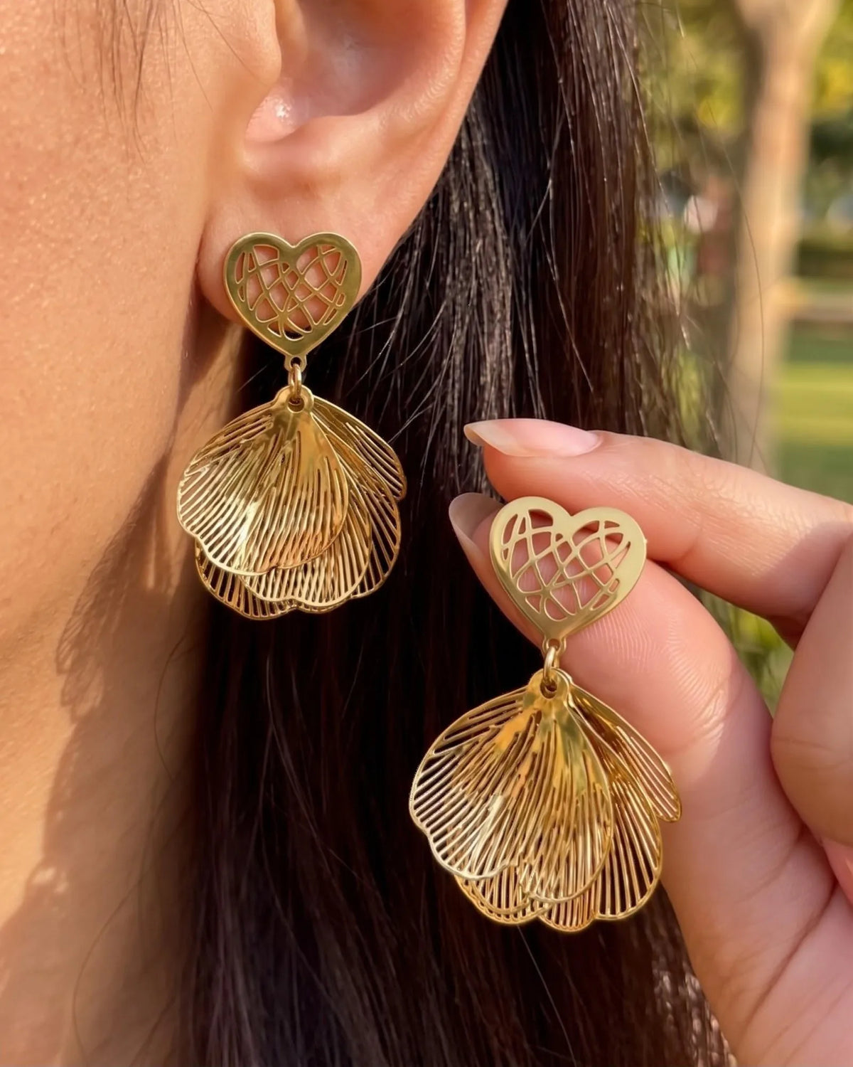 Gold filigree heart stud earrings with layered petal drops