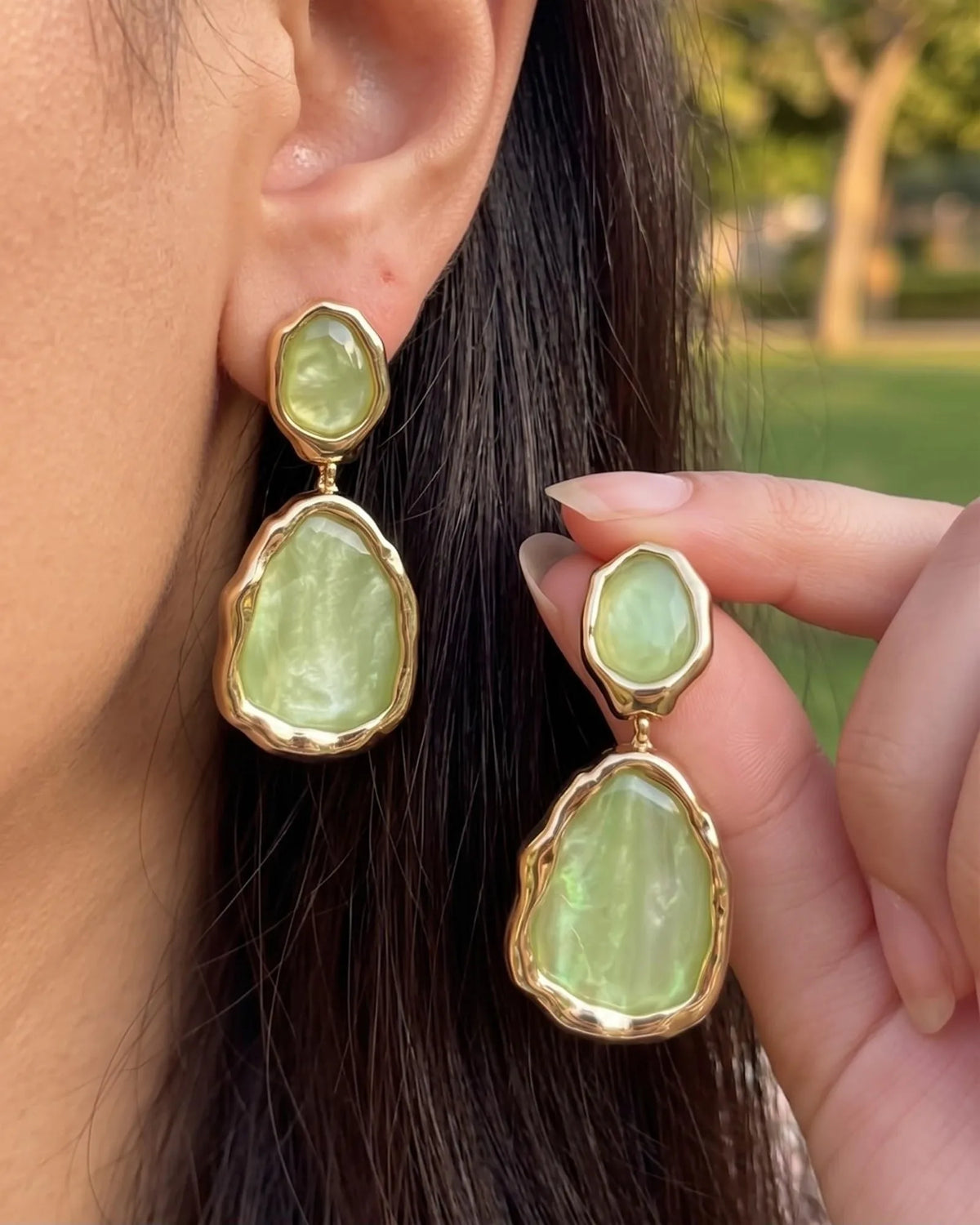 Gold-framed pistachio green pearlescent stone drop earrings