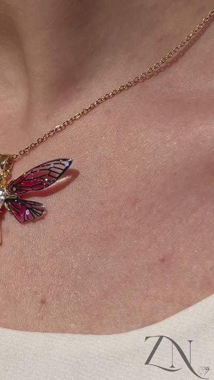 Hummingbird pendant necklace in gold finish, shown worn with soft movement and close-up sparkle.