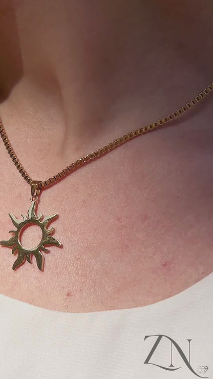 Enchanted sun pendant necklace with gold rays, styled with soft movement and Rapunzel-inspired glow.