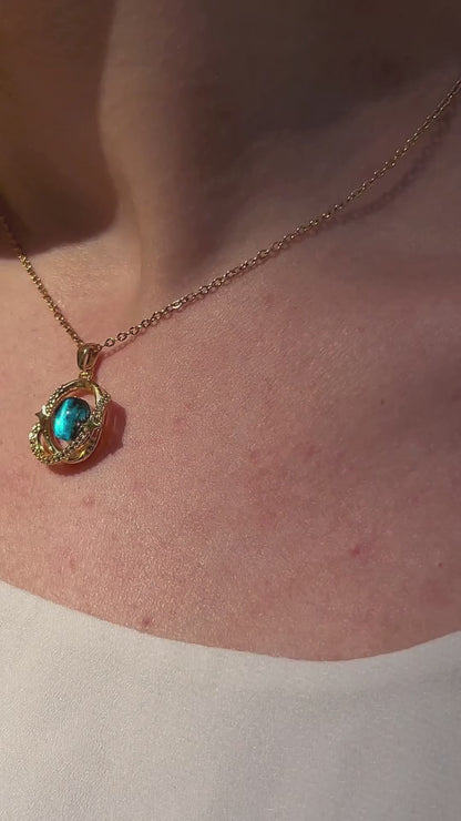 Galactic orbit necklace with cosmic-themed pendant shown worn, capturing shimmer and space-inspired motion.